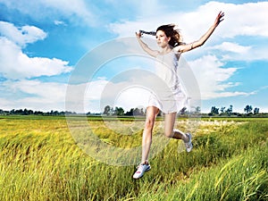 Woman running across field