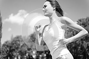 Woman running on arena track.