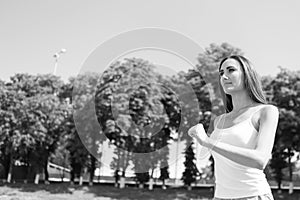 Woman running on arena track.