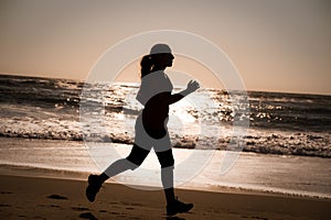 Woman running on the beach