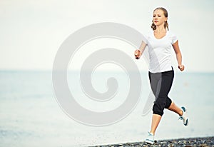 Woman running on the beach