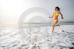 Woman running on the beach