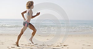 Woman Running On The Beach