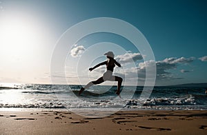 Woman running on the beach. Healthy woman run at sea, girl doing sport outdoor, happy female exercising, fitness and