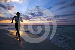 Woman running on the beach during sunset.