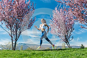 Woman running for fitness on a spring day