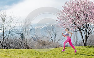 Woman running for fitness on a spring day