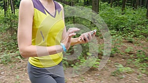 Woman running with fitness tracker