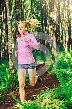 Woman Running on the Forrest trail