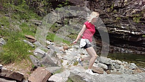 woman in great waterfall of Bignasco photo