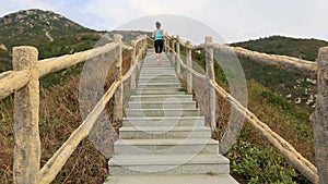 Woman running on mountain stair