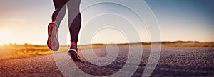 Woman running outdoors on the evening sunset.