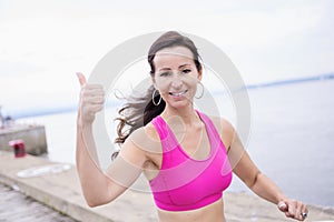 Woman running outdoors training for marathon run