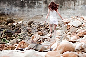 Woman running on the rocks