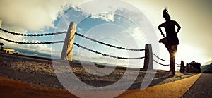 Woman running on seaside trail