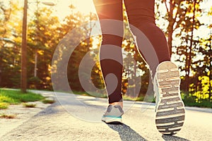 Woman in running shoes ready for a jog outside