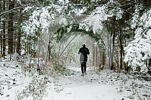 Woman running in the snow