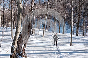 Woman running in the snow