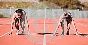 Woman, running and start in sports competition, race or fitness on outdoor stadium track together. Female person or