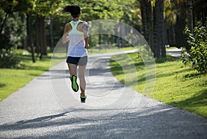 Woman running on sunny coast