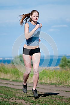 Woman running on sunny day