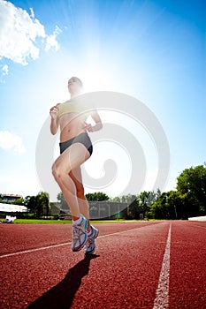 Woman running on sunny day