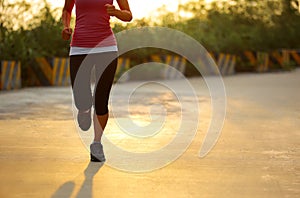 Woman running sunrise
