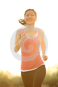 Woman running sunrise