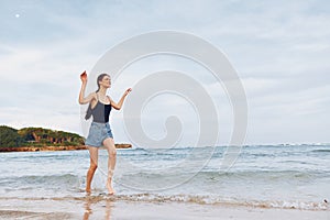 woman running sunset flight lifestyle beach summer young smile travel sea
