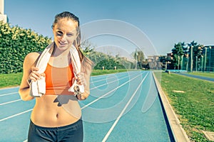 Woman running on a track