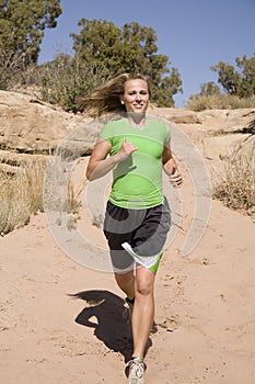 Woman running on trail
