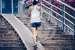 Woman running up city stairs