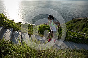 Woman running up on seaside