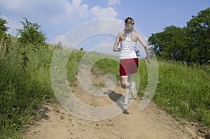 Woman running uphill