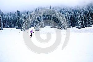 Woman running in winter, fitness inspiration and motivation