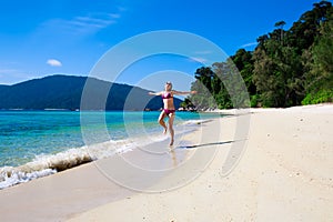 Woman runnnig on beach