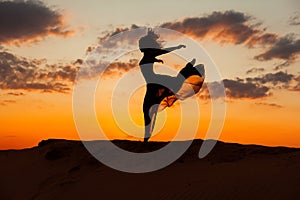 Woman is running at sunset. photo