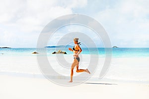 Woman runs on the beach