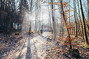 Woman runs in park - late autumn, first snow