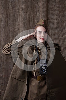 Woman in Russian military uniform with camera. Female war correspondent during the second world war.