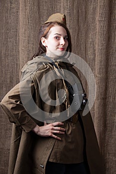 Woman in Russian military uniform with camera. Female war correspondent during the second world war.