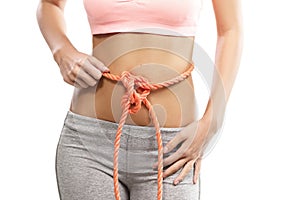 Woman's abdomen tied with a rope