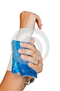 Woman's arm with bandage and ice painkiller