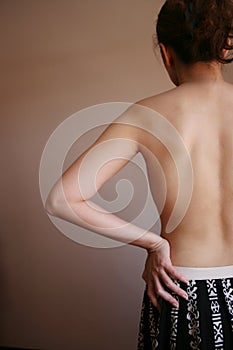 Woman's back with arm on waist