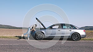 Woman's Car Break Down on Field