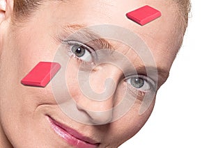 Woman's face with erasers