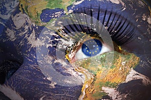 Woman`s face with planet Earth texture and european union flag i