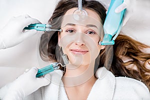 Woman`s facial treatment photo