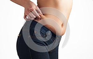 Woman`s fat belly. Overweight and weight loss concept.