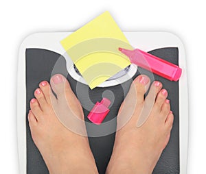 Woman' s feet on bathroom scale